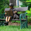 Bronze Girl Reading Book with Dog on Bench Sculpture