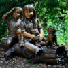 SRB41068-Kids-on-Log-with-Dog.jpg Bronze Kids and Dog on Log Sculpture