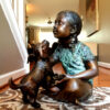 SRB706753-Bronze-Sitting-Girl-with-Dog-Sculpture-by-Metropolitan-Galleries-Inc.jpg Bronze Girl Sitting with Dog Sculpture