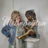 Bronze Sitting Girl holding Bird Sculpture
